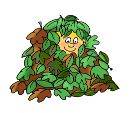 boy playing in pile of autumn leaves