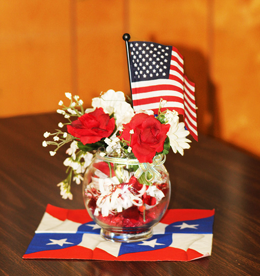 patriotic flower and flag arrangement