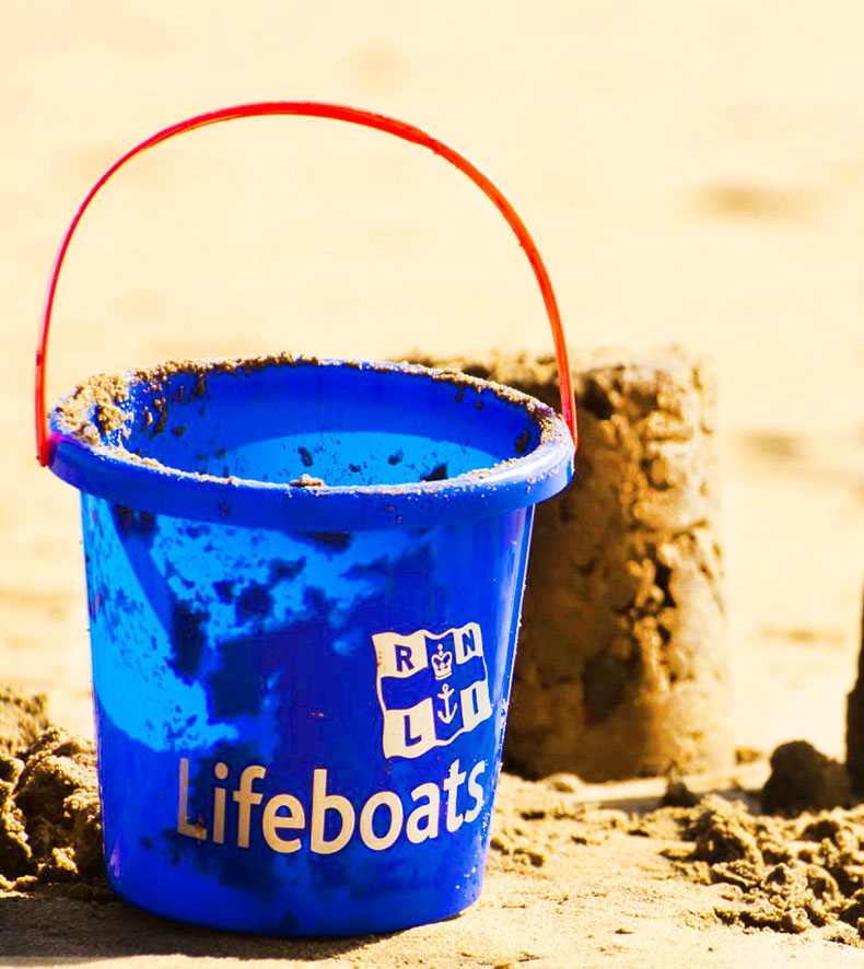 bucket on the beach sand