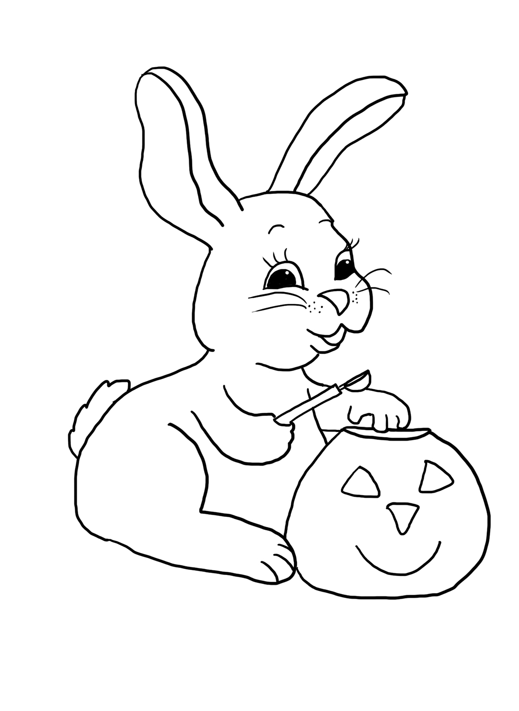 halloween bunny carving a pumpkin head