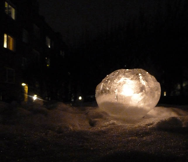 beautiful ice lantern in the winter snow