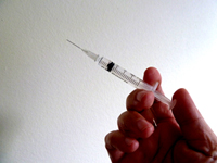 hand with syringe medical image