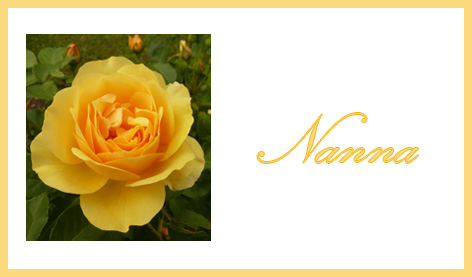 place card with orange rose and name