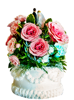 wedding cake with bride and groom and flowers
