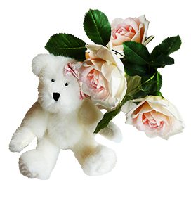 white Teddy bear with pink roses